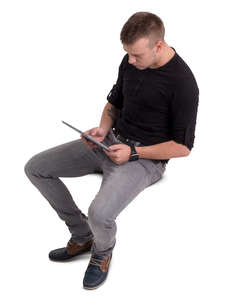 man sitting with a tablet seen from above