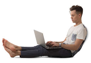 man sitting and working with laptop