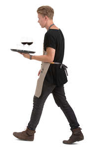 male waiter with a tray walking