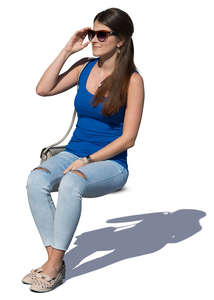 young woman with sunglasses sitting