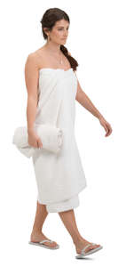 woman in a sauna towel walking