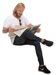 man sitting and reading a newspaper