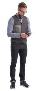 man standing and lookig at his phone