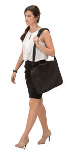 young businesswoman with a laptop bag walking