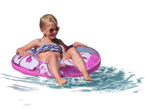 young girl floating with a swimming ring