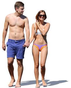 couple in bathing suits walking hand in hand
