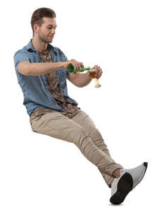 man sitting in a cafe and drinking beer