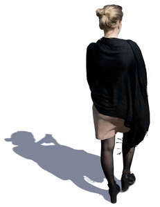 woman with a black shawl walking