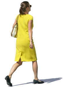 woman in a yellow dress walking