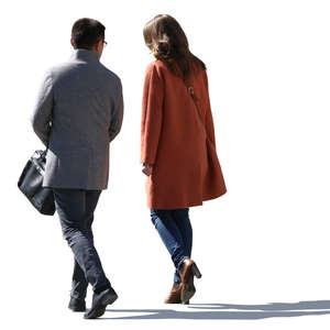 backlit man and woman in spring coats walking