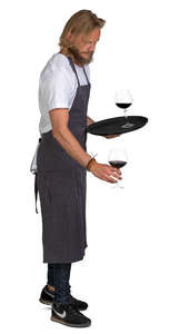 waiter putting glasses on the table