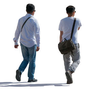 backlit asian men walking