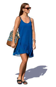 woman in a blue summer dress walking