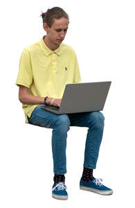 man sitting and working with laptop