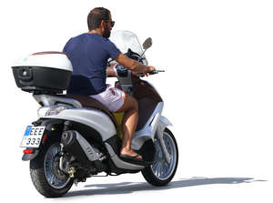 man riding a scooter in the summer