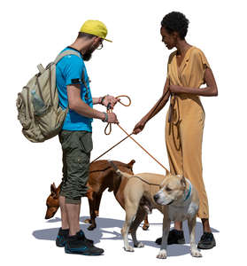 man and woman with dogs standing and talking