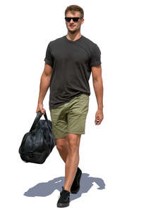 man carrying a sports bag walking