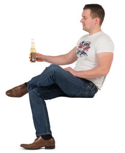 man sitting and drinking beer