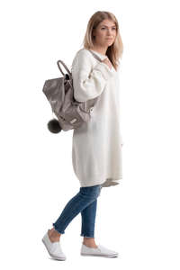 woman in a white sweater walking