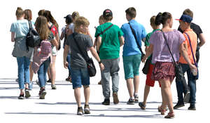 group of young people walking in the summer