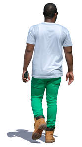 black man in green pants walking