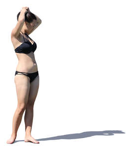 asian woman in a bikini standing