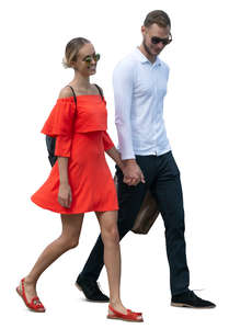 smiling couple walking hand in hand