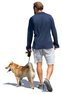 man walking a dog in the summer