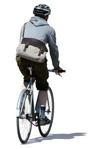 man with a helmet riding a bicycle