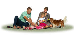 family with a dog having a picnic