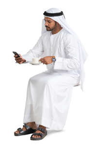 arab man sitting in a cafe