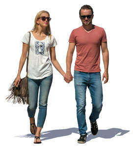 couple walking hand in hand on a sunny day