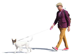 man in a colorful outfit walking a dog