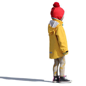 young girl in a yellow raincoat standing