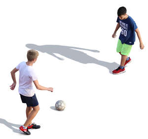 two boys playing football seen from above