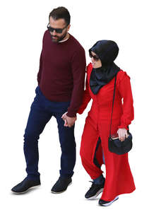 muslim couple walking hand in hand seen from above