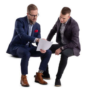 two businessmen sitting and talking