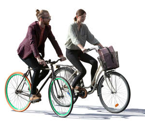 backlit man and woman riding a bike side by side