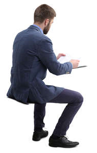 man sitting and reading paperwork