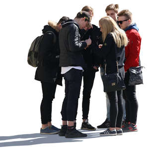 group of six young people standing and looking at smth