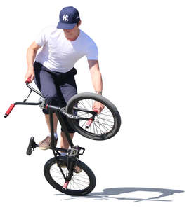 young man doing a bmx trick