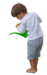 little boy watering plants