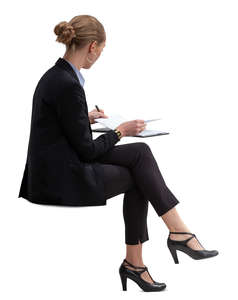 businesswoman sitting and checking her calendar