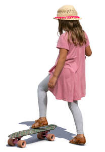 little girl with a skateboard standing