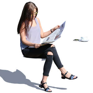 woman sitting in the sun and reading a newspaper