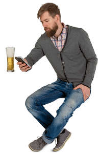 man sitting and drinking beer