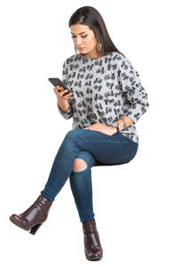 woman sitting and checking her phone