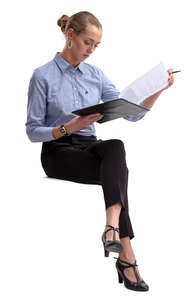 businesswoman sitting and reading some papers