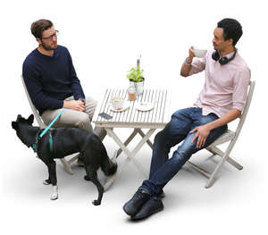 two men and a dog in a cafe seen from above