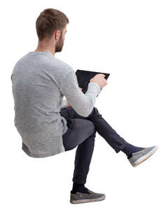 man with a tablet sitting